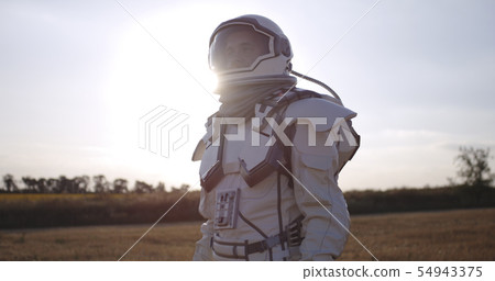 Astronaut opening helmet on Mars 54943375