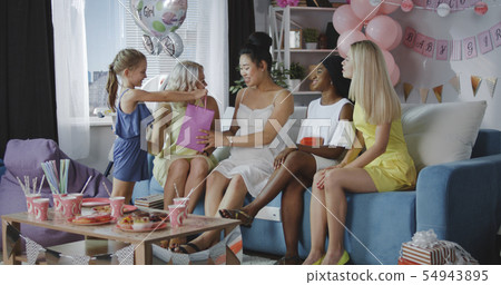 Friends celebrating young mother 54943895
