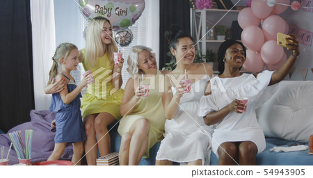 Friends celebrating young mother Friends celebrating young mother 54943905
