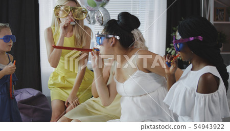 Friends celebrating young mother Friends celebrating young mother 54943922