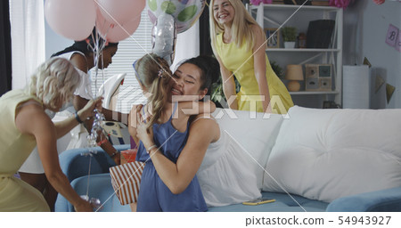 Friends celebrating young mother Friends celebrating young mother 54943927