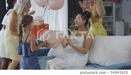Friends celebrating young mother Friends celebrating young mother 54943928