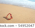 Red sunglasses on the beach 54952047