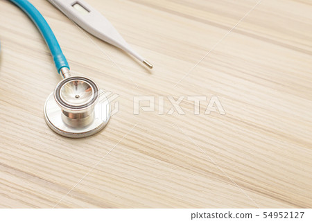 The blue stethoscopes on wood table 54952127
