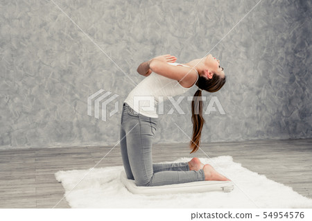 Young woman yoga on carpet at home living room. Young woman yoga on carpet at home living room. 54954576