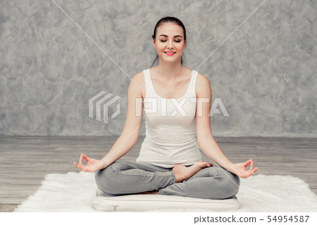 Young woman yoga on carpet at home living room. Young woman yoga on carpet at home living room. 54954587