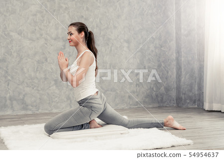 Young woman yoga on carpet at home living room. Young woman yoga on carpet at home living room. 54954637