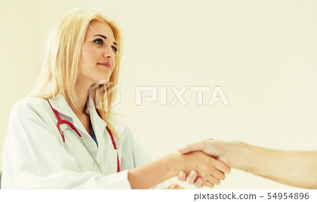 Woman Doctor and Male Patient in Hospital Office 54954896