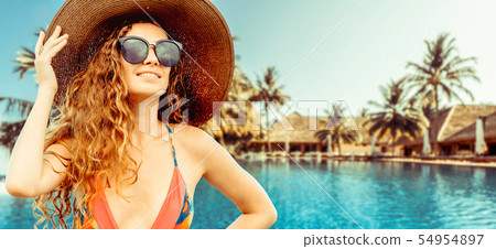 Happy young woman at beach in summer vacation. 54954897