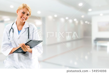 Woman doctor working at the hospital office. 54954898