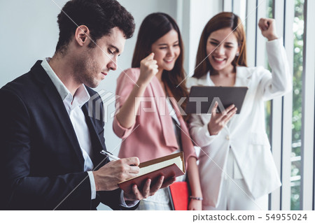 Businessman reading book in business office . Businessman reading book in business office . 54955024