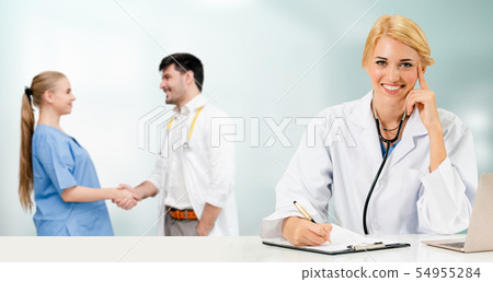 Doctor working in hospital with other doctors. Doctor working in hospital with other doctors. 54955284