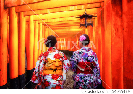 Traveler in Fushimi Inari Shrine, Kyoto, Japan Traveler in Fushimi Inari Shrine, Kyoto, Japan 54955439