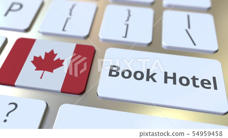 BOOK HOTEL text and flag of Canada on the buttons on the computer keyboard. Travel related 54959458