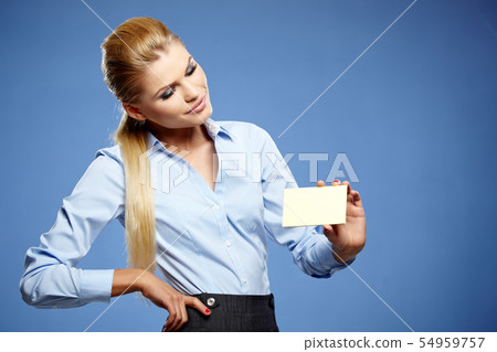 Businesswoman holding credit card. Isolated on 54959757