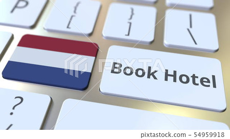 BOOK HOTEL text and flag of the Netherlands on the buttons on the computer keyboard. Travel related 54959918