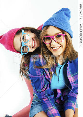 two best friends teenage girls together having fun, posing emotional on white background, besties two best friends teenage girls together having fun, posing emotional on white background, besties 54960266