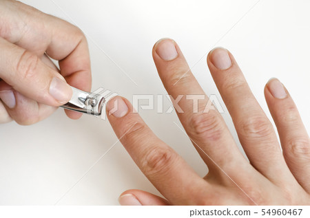 A young man does a manicure. Photo. A young man does a manicure. Photo. 54960467