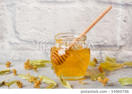 jar of liquid honey from Linden flowers  54960786