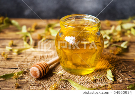 A jar of liquid honey from Linden flowers  54960954