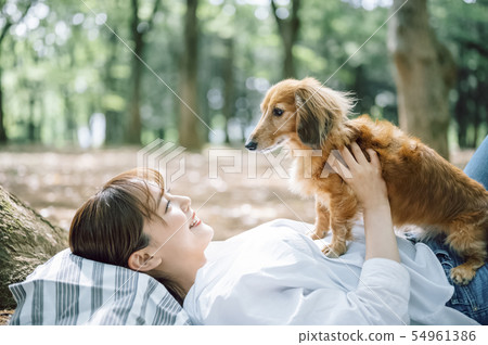 Life with a dog Woman 54961386
