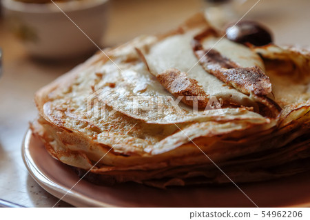 Stack of hot classic Russian thin pancakes. Rustic style. Traditional for the Russian pancake week - Stack of hot classic Russian thin pancakes. Rustic style. Traditional for the Russian pancake week - 54962206
