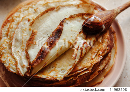 Stack of hot classic Russian thin pancakes. Rustic style. Traditional for the Russian pancake week - Stack of hot classic Russian thin pancakes. Rustic style. Traditional for the Russian pancake week - 54962208