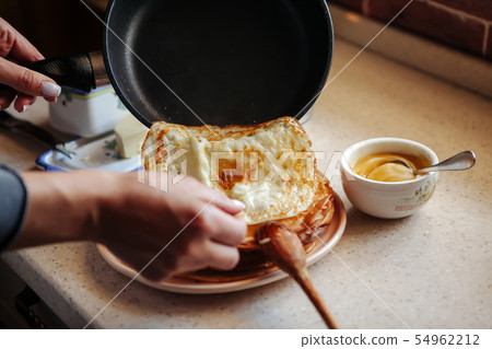 Stack of hot classic Russian thin pancakes. Rustic style. Traditional for the Russian pancake week - Stack of hot classic Russian thin pancakes. Rustic style. Traditional for the Russian pancake week - 54962212