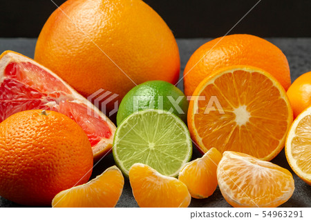 group of whole and sliced citrus fruits - tangerines, lemons, limes, oranges, grapefruits 54963291