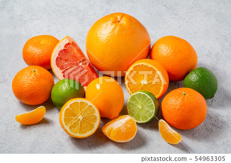 group of whole and sliced citrus fruits - tangerines, lemons, limes, oranges, grapefruits on the group of whole and sliced citrus fruits - tangerines, lemons, limes, oranges, grapefruits on the 54963305