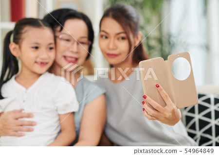 Family selfie portrait on phone Family selfie portrait on phone 54964849