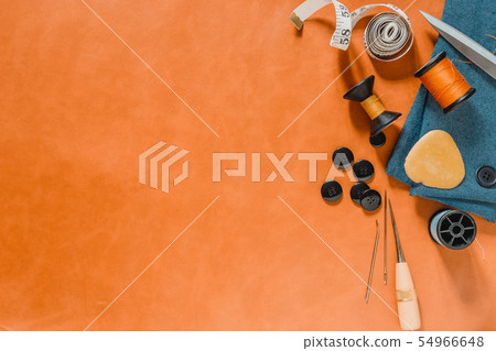 Crafting tools on natural leather on background. Crafting tools on natural leather on background. 54966648