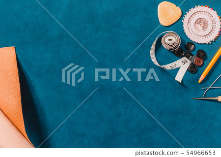 Crafting tools on natural leather on background. 54966653