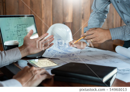 Confident engineer team working with Blue Print Confident engineer team working with Blue Print 54968013