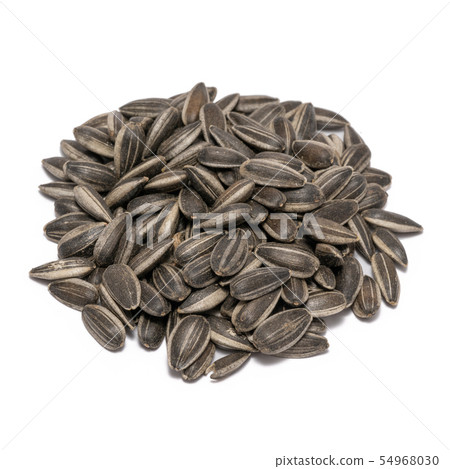 Sunflower seeds close up isolated on white background Sunflower seeds close up isolated on white background 54968030