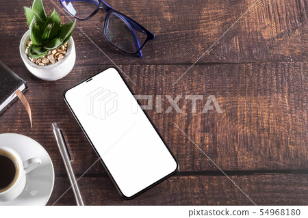 Working table with smartphone notepad coffee cup Working table with smartphone notepad coffee cup 54968180