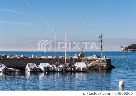 Boats moored in harbor. Castle of Miramare  54969200