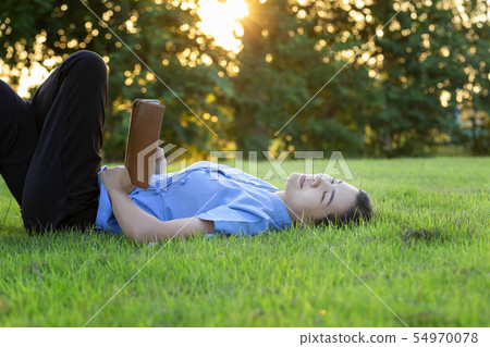 Portrait of beautiful young women who relax by Portrait of beautiful young women who relax by 54970078