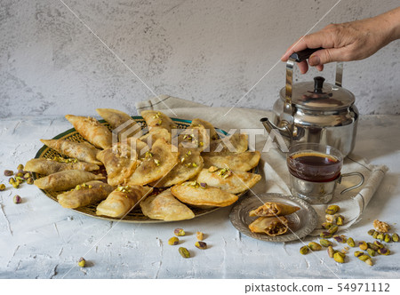 Arabic Traditional dessert Qatayef or Atayef  54971112