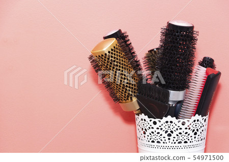 many different combs in the stand, Barber concept. many different combs in the stand, Barber concept. 54971500