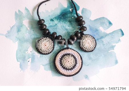Handmade accessories in ethnic style on wooden Handmade accessories in ethnic style on wooden 54971794