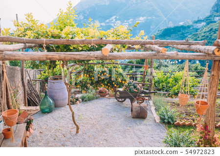 Summer empty outdoor cafe in a tourist place in Summer empty outdoor cafe in a tourist place in 54972823