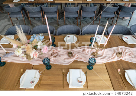 luxury dinner Banquet in the restaurant. Beautiful and exquisite decoration of the wedding luxury dinner Banquet in the restaurant. Beautiful and exquisite decoration of the wedding 54973242