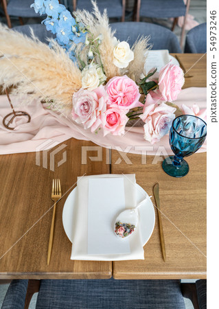 luxury dinner Banquet in the restaurant. Beautiful and exquisite decoration of the wedding luxury dinner Banquet in the restaurant. Beautiful and exquisite decoration of the wedding 54973246