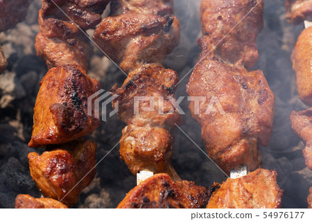 Close-up view grilled tasty pork shish kebab grill Close-up view grilled tasty pork shish kebab grill 54976177