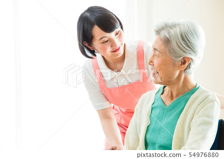 Nursing care senior female helper caregiver 54976880