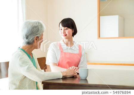 Nursing care senior female helper caregiver 54976894