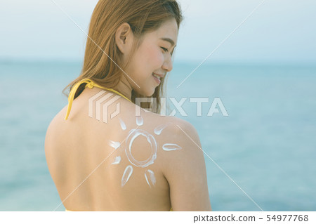 woman smile with healthy skin applying sunscreen woman smile with healthy skin applying sunscreen 54977768