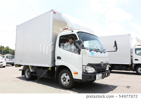 Young Woman Wearing A Track And Workwear Young Woman Wearing A Track And Workwear 54977872