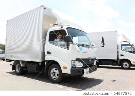 Young Woman Wearing A Track And Workwear 54977873